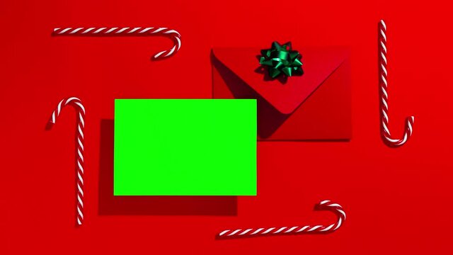 Christmas letter to Santa. Mockup of the letter with the copy of space and the letter with the festive decorations on a red background. Stop motion animation.