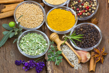 Variety of spices on wooden background