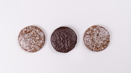 Typical German gingerbread cookies on a white background. Traditional Christmas treat. Top view,...