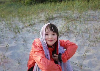 Portrait of little girl smiling outside