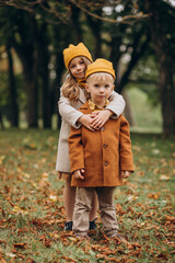 Brother and sister having fun together in park