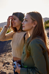 Two light hearted ladies standing outside