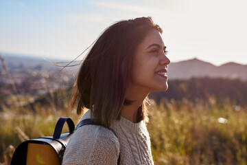 A contemplative lady casually walking uphill