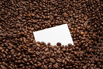 Blank business card mockup on coffee seeds background,  coffee packaging mockup with empty space to...