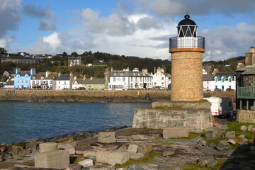 View of old lighthouse and fishing harbour, Portpatrick, Dumfries and Galloway, Scotland, United...