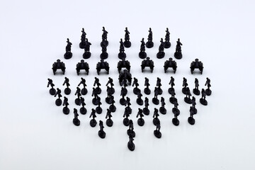 regiment of black plastic soldiers on white background