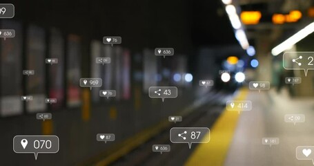 Animation of social media icons and numbers over out of focus train in station - Powered by Adobe