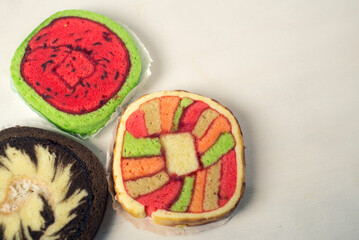 Colorful and various kind of sweets, candies and cake over white background