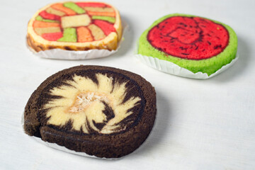 Colorful and various kind of sweets, candies and cake over white background