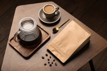 Blank coffee packaging on a wooden table, with pot, coffee seeds bowl, on a wooden background,...
