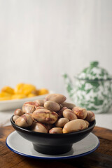 Boiled or steamed jack fruit seed, traditional healthy snack for tea or coffee time with rustic white background