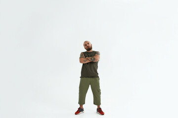 Bald confident caucasian man with crossed arms