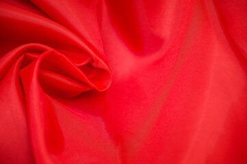 Abstract red fabric background. Copy space.