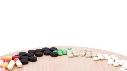 Obraz na płótnie Canvas Assorted pharmaceutical medicine pills, tablets and capsules over blue background