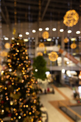 store market decorated with Christmas eve concept festive garlands and lamps illumination lighting with bokeh effect, vertical concept