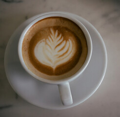 cup of cappuccino on a table with latte art