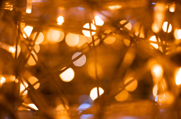 blurred unfocused bokeh effect light from festive garland illuminations