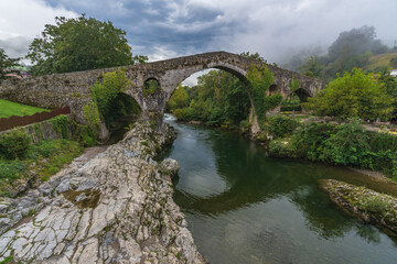 View of the Roman bridge in the city of Cangas de Onis in Asturias. 