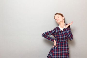 Shot of funny young blond woman making flirtatious grimaces and posing