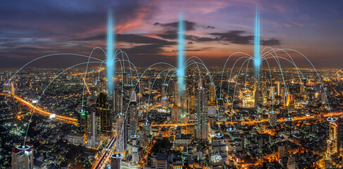 Computer Network connection line between building over Scene of Panorama of Bangkok cityscape which have Modern building and river side at night time, Connectivity and global networks concept