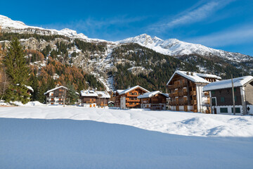 Alpine village in the winter season . Macugnaga (Staffa), Italy, important winter ski resort at the...