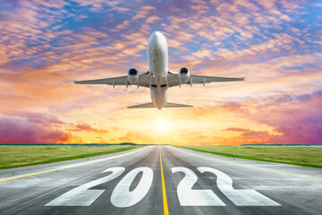 The inscription on the runway 2022 surface of the airport runway with take off airplane. Concept of...