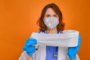 Doctor with rolls of toilet paper in his hands. A nurse holds a lot of rolls of white toilet paper,...