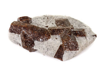 macro mineral stone Staurolite on a white background