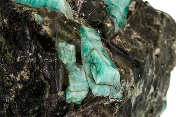 Fototapeta na wymiar Macro emerald stone mineral in rock on white background