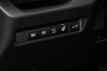 Close up of Heated steering wheel switch on. Steering wheel heating button in the modern car.