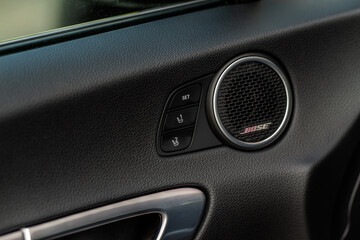 Fototapeta na wymiar Electric car seat adjustment control panel close up view. Adjustable car seat position buttons on the door. Car interior.