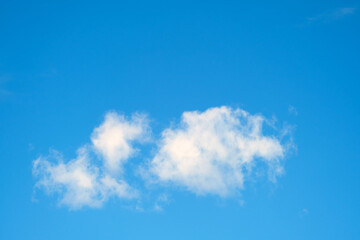 White cloud on the background of the daytime sky, copy space