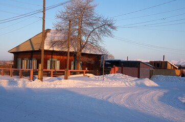 Traditional village in winter in Siberia, Russia