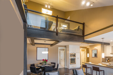 Modern, bright, clean, kitchen interior with stainless steel appliances in a luxury house