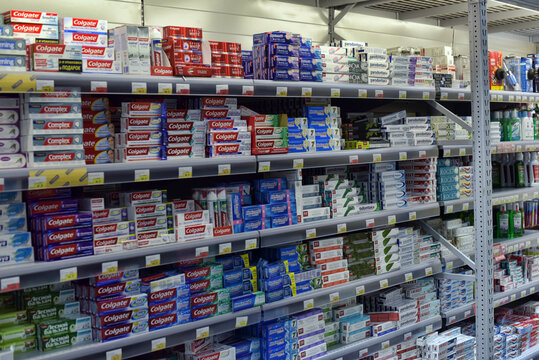 Toothpaste on a shelf in a supermarket