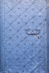 Old door with an interesting ornament, close-up.