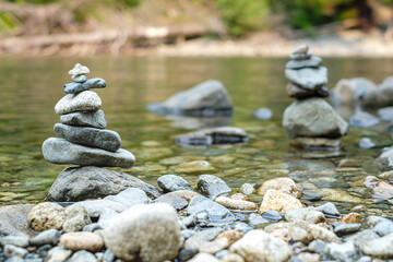 Fototapeta na wymiar A pile of pebbles by a river on Middle Fork Trail, North Bend, WA, USA