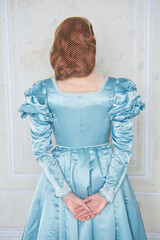 Hands of woman in beautiful medieval dress back pose