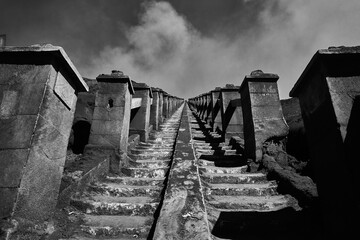 stairs going to the volcano hole and white in indonesia Bromo jakarta