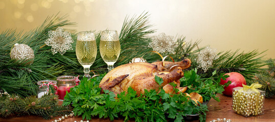 Christmas or Thanksgiving. Baked chicken stuffed with apples for Christmas dinner on the festive table.