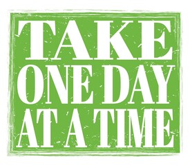 TAKE ONE DAY AT A TIME, text on green stamp sign