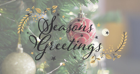 Image of seasons greetings text over christmas tree © vectorfusionart