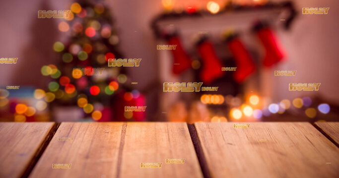 Image of holly text in repetition over christmas tree