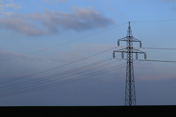 Electrical distribution network. High voltage pole. High voltage pylons. Infrastructure.