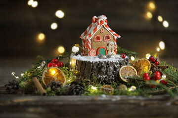 A little christmas gingerbread house on the wooden background