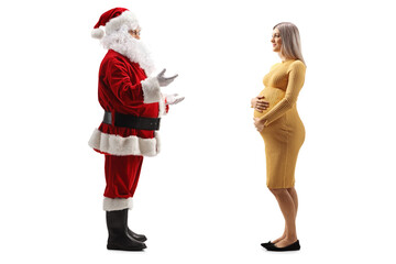 Full length profile shot of santa claus talking to a pregnant woman