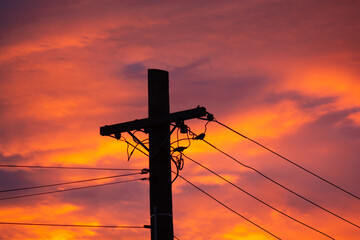 Electricity Power Lines silhouette into the sunset.  Renewable energy in New Zealand