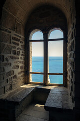Fototapeta na wymiar Sea view from the window of the old castle.