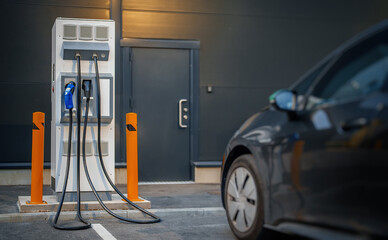 Electric car charging station and electric car.