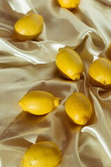 Yellow whole and sliced lemons. Isometric view of a minimal still life.